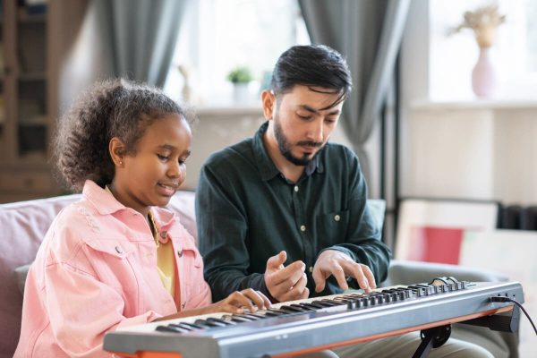 adorable-schoolgirl-and-her-music-teacher-playing-2021-12-16-00-26-04-utc.jpg